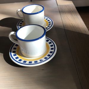 A set of cups with small plates